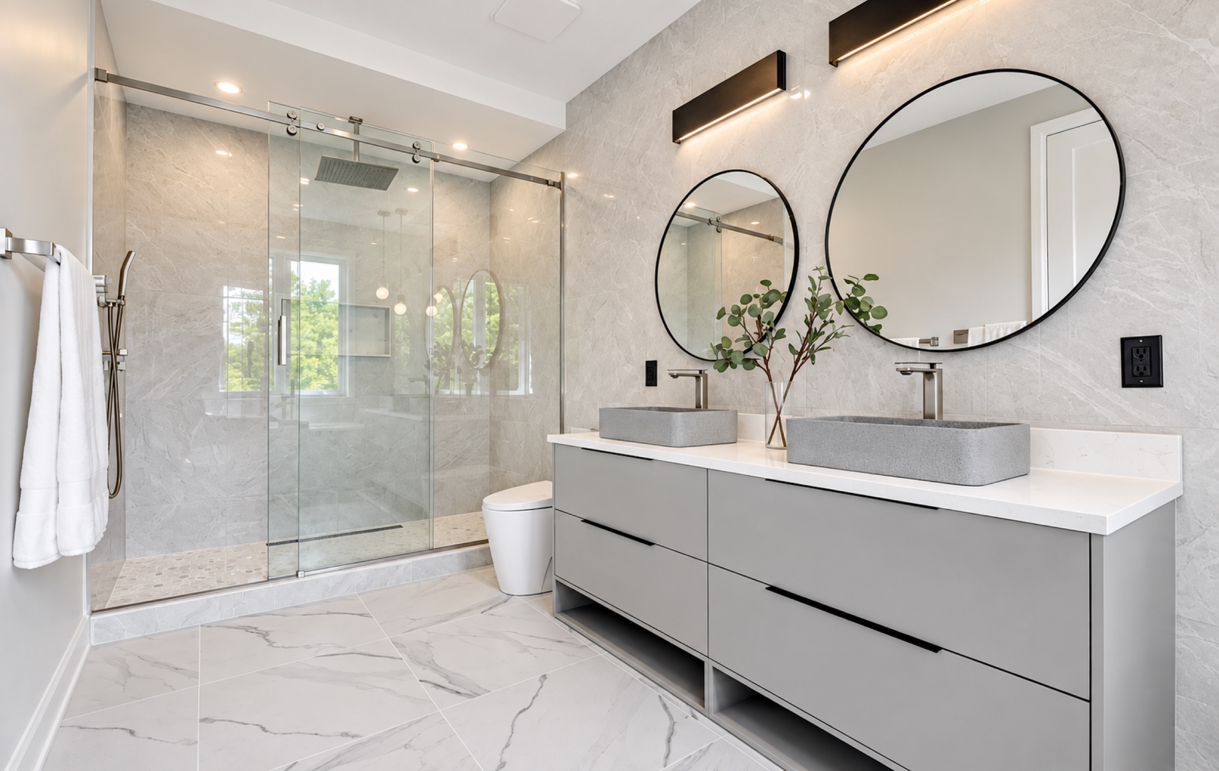Modern bathroom with a glass walk-in shower and floating double vanity